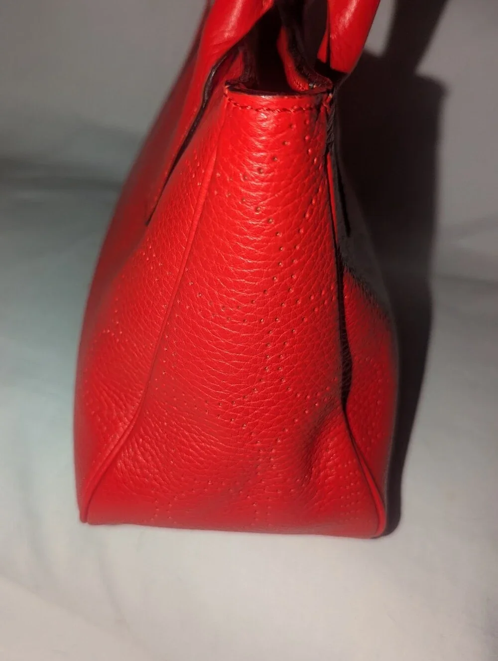 Kate Spade New York  Noel Rue Red Pebbled Perforated Leather Tote Bag.